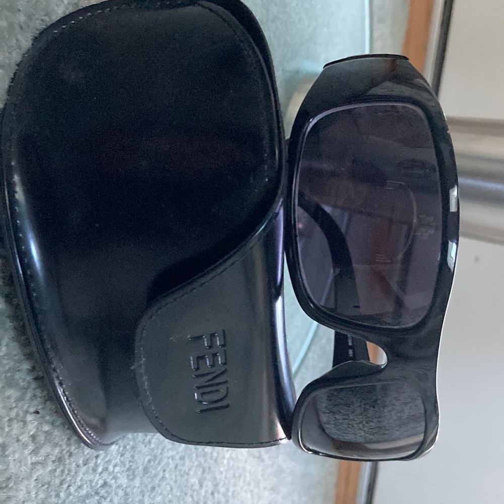 Fendi black ladies wrap around sunglasses.Original Fendi sunglass case included.